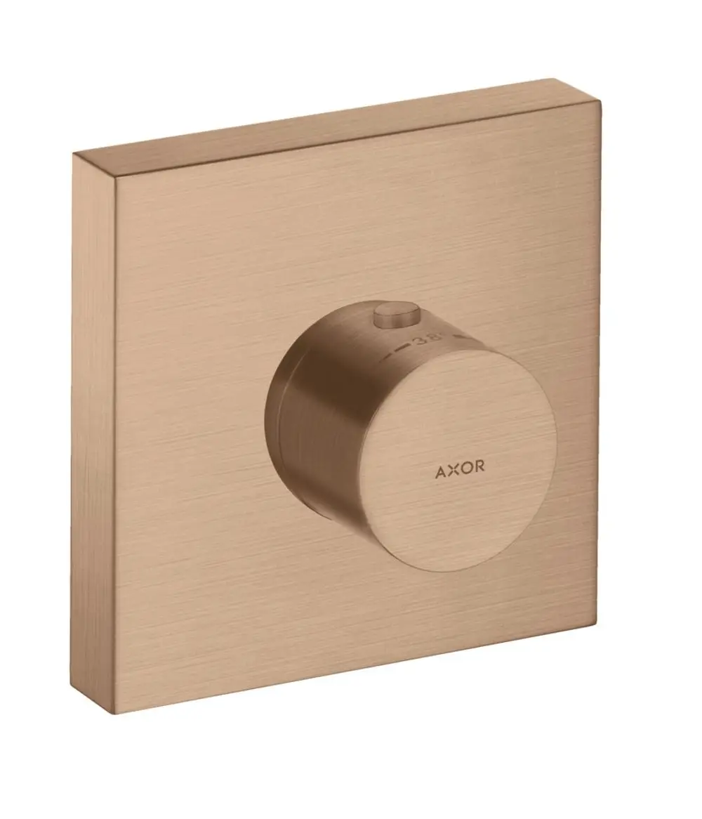 Thermostatmodul mit runder Bedienknopf in gebürstetem Rotgold, montiert auf quadratischer Grundplatte, Marke AXOR.